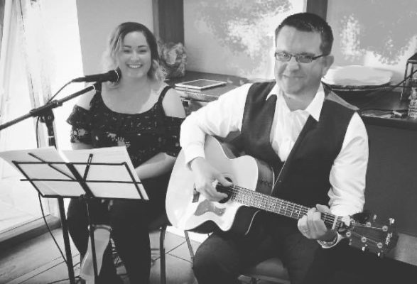 An image of Lux Bay acoustic duo playing live at a wedding breakfast in Liverpool, following a live set at the wedding ceremony.